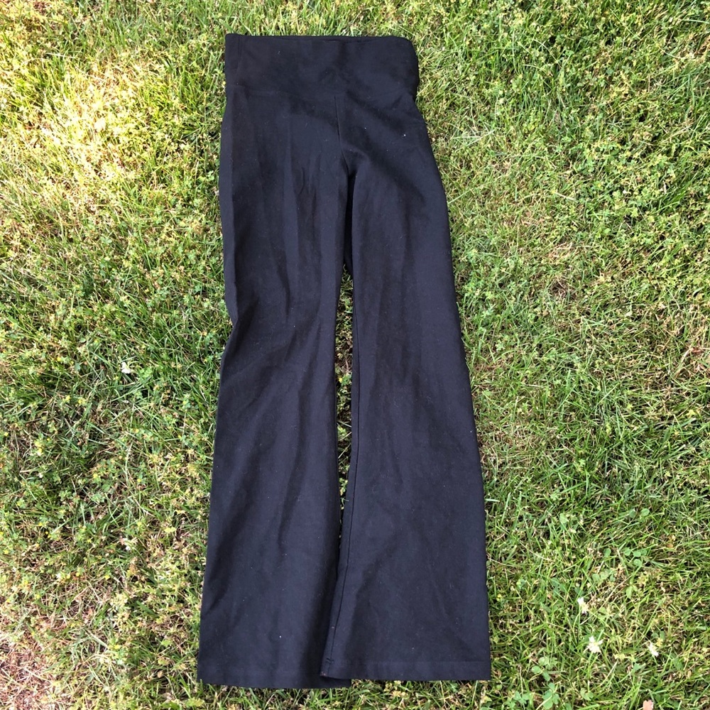 Black yoga pants with gold angel wings on the top